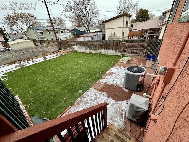 view of yard featuring central air condition unit