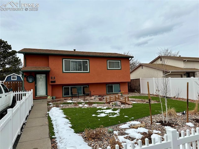 view of front of home with a lawn