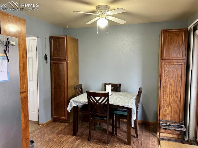 dining space featuring hardwood / wood-style floors and ceiling fan