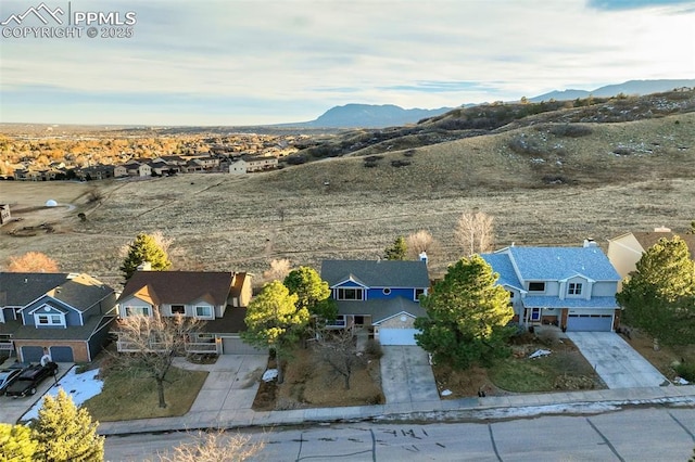 birds eye view of property featuring a mountain view