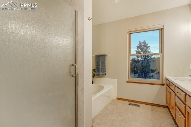 bathroom with vanity, shower with separate bathtub, and tile patterned flooring