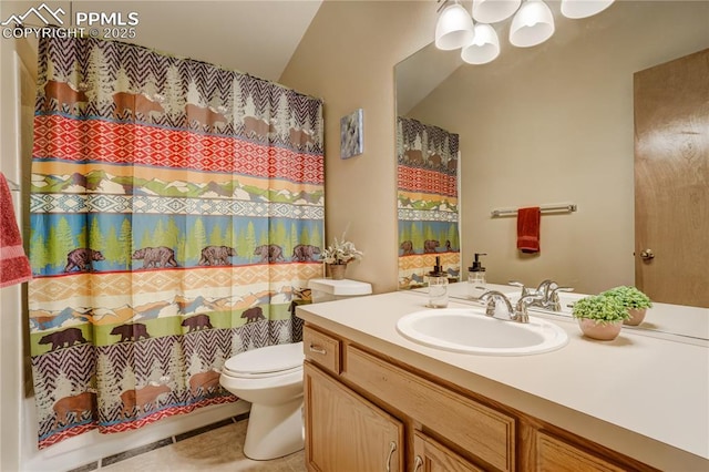 bathroom with vanity, tile patterned floors, and toilet