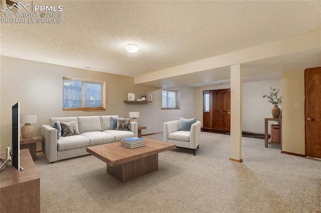 living room with light colored carpet and a textured ceiling