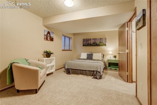 carpeted bedroom with a textured ceiling