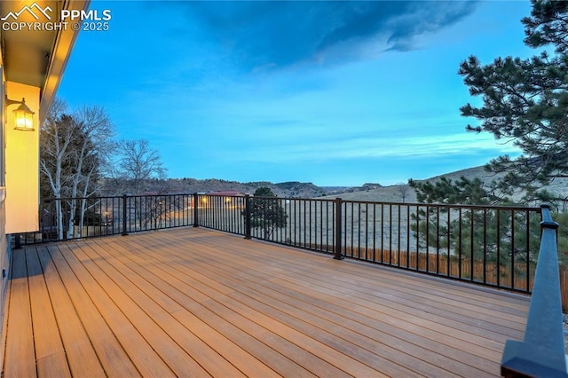 wooden deck featuring a mountain view