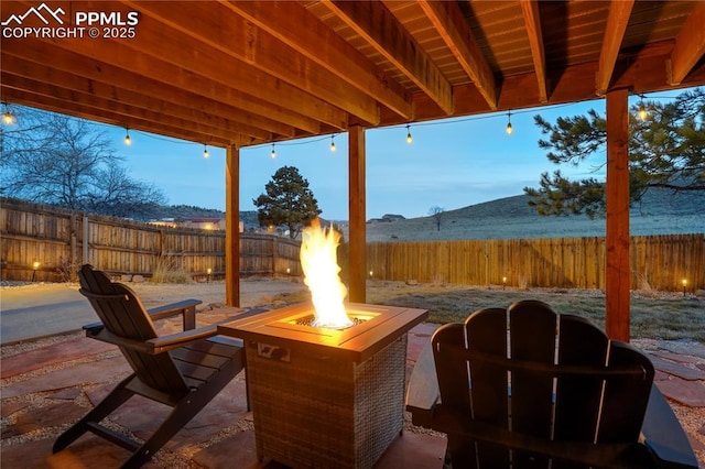 patio terrace at dusk with an outdoor fire pit