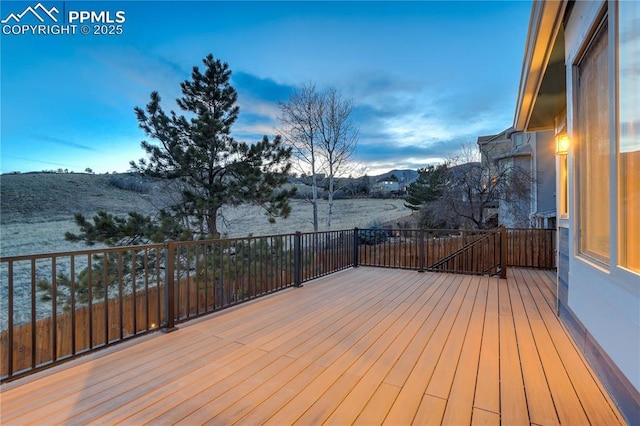 wooden deck featuring a mountain view