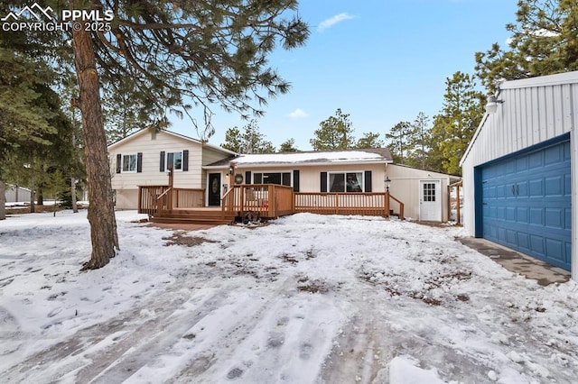 view of front of property featuring a wooden deck and a garage