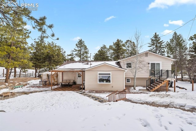 view of snow covered house