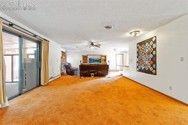 unfurnished living room with ceiling fan, a textured ceiling, and carpet flooring