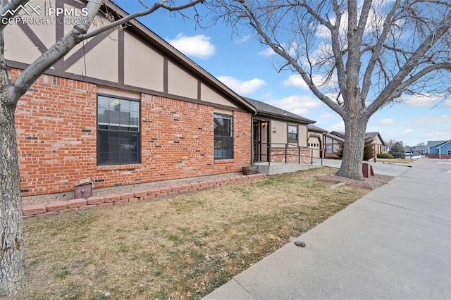 view of property exterior featuring a lawn