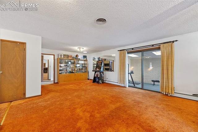 interior space with carpet flooring and a textured ceiling