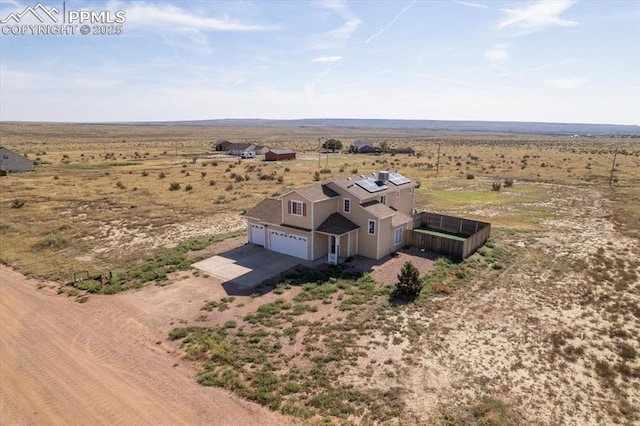 birds eye view of property with a rural view