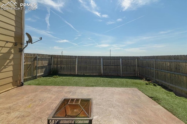 view of yard with a fire pit and a patio