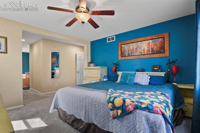 bedroom featuring ceiling fan and carpet