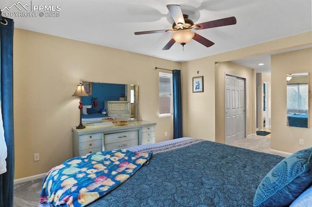 carpeted bedroom featuring ceiling fan