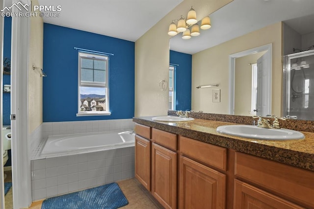 bathroom with vanity, plus walk in shower, and tile patterned flooring