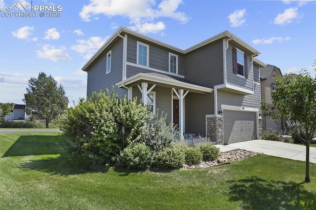 view of front of property featuring a garage and a front yard