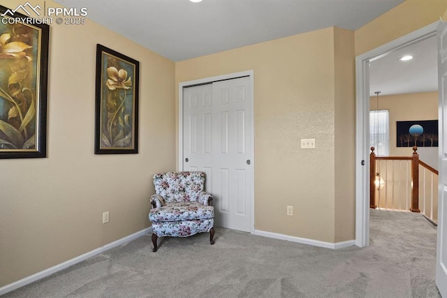 living area with light carpet