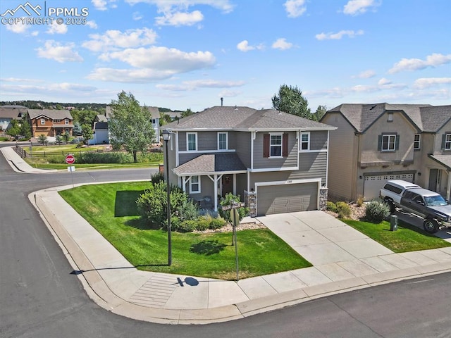 view of front of house featuring a garage and a front lawn