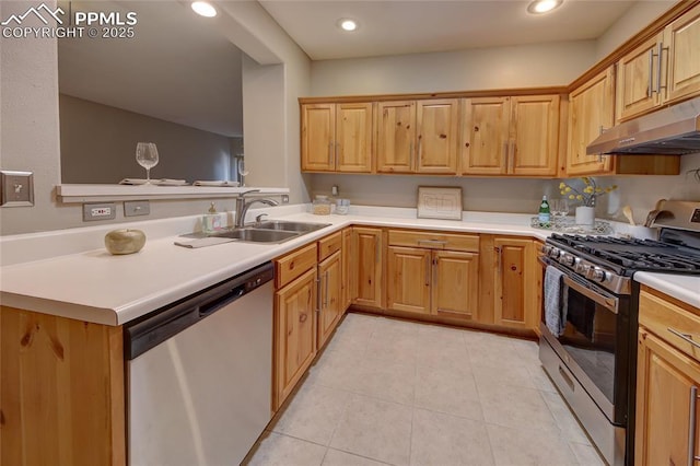 kitchen featuring sink, stainless steel appliances, kitchen peninsula, and light tile patterned flooring