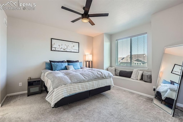 bedroom featuring light carpet and ceiling fan