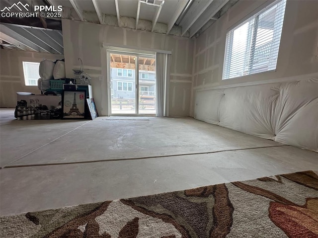 unfurnished room featuring concrete floors