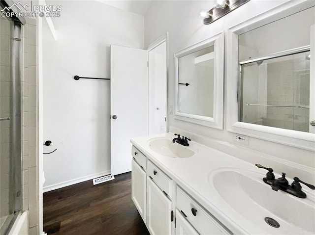 bathroom with vanity and wood-type flooring