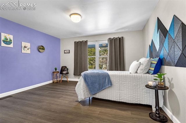 bedroom featuring dark hardwood / wood-style floors