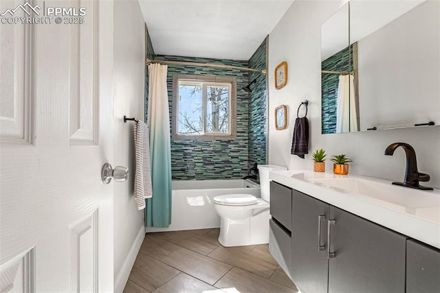 full bathroom with vanity, toilet, and shower / bath combo with shower curtain