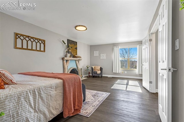 bedroom with dark wood-type flooring