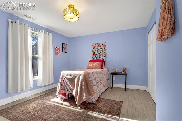 bedroom with light hardwood / wood-style flooring