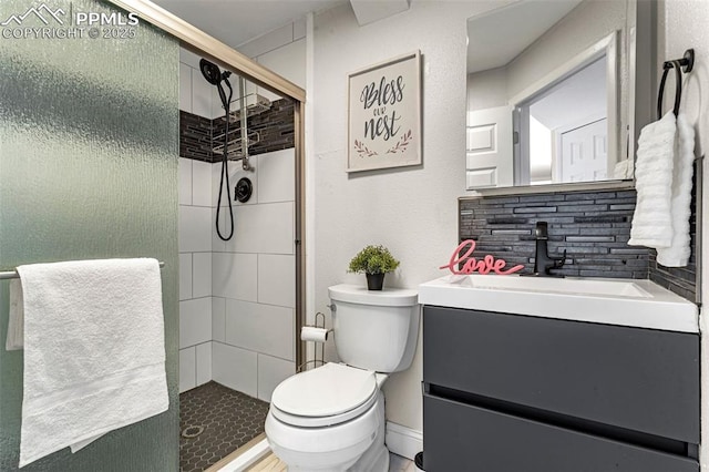 bathroom with vanity, walk in shower, and toilet