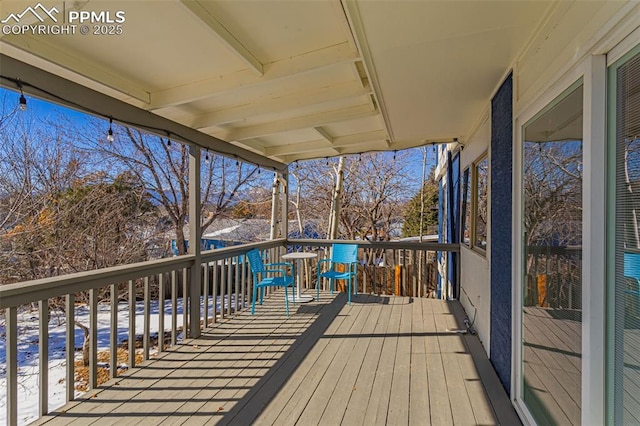 view of snow covered deck