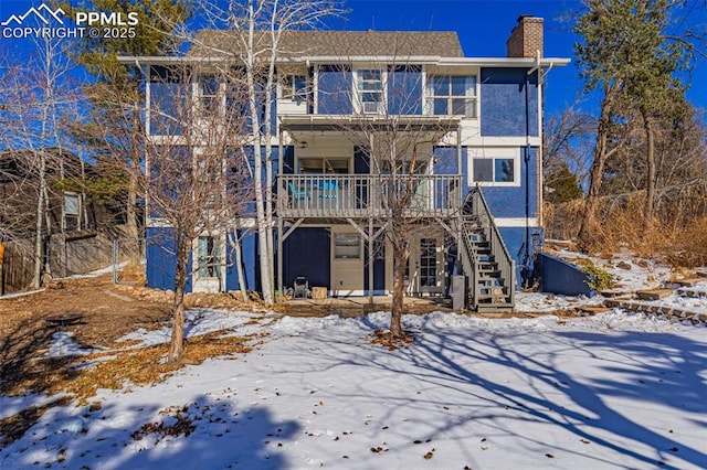 view of snow covered house