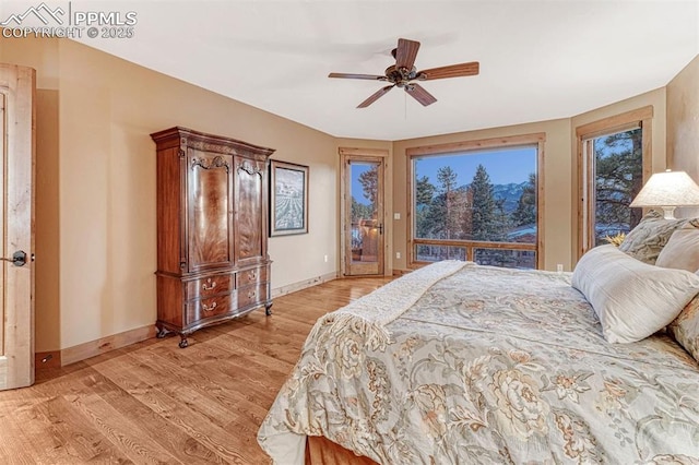 201 Fox Mountain Dr, Woodland Park, CO 80863 - bedroom with ceiling fan, light hardwood / wood-style flooring, and access to outside