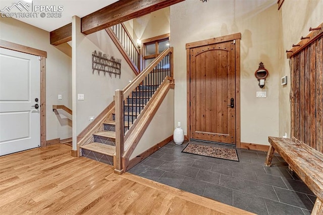 201 Fox Mountain Dr, Woodland Park, CO 80863 - foyer featuring beamed ceiling and dark wood-type flooring
