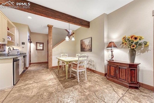 201 Fox Mountain Dr, Woodland Park, CO 80863 - dining room featuring decorative columns, sink, an inviting chandelier, and beam ceiling