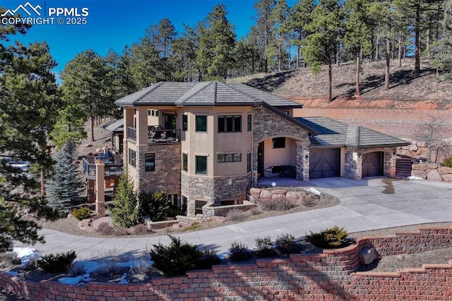 201 Fox Mountain Dr, Woodland Park, CO 80863 - view of front of property featuring a balcony and a garage