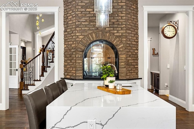 dining space featuring dark wood-type flooring