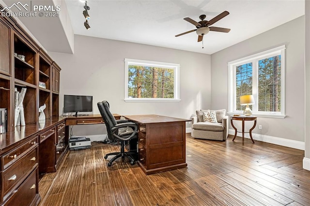 office with dark wood-type flooring and ceiling fan