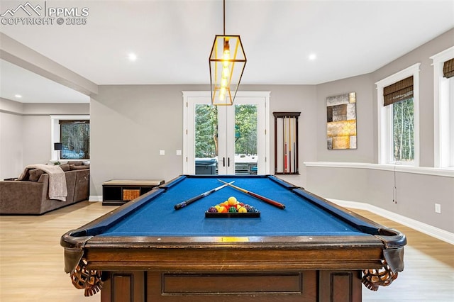 playroom featuring hardwood / wood-style flooring, french doors, and a wealth of natural light