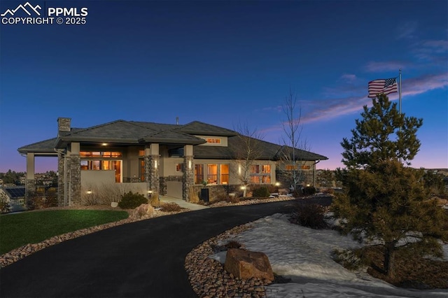 prairie-style home featuring a garage