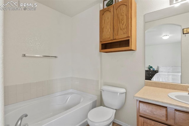 bathroom featuring vanity, a bathing tub, and toilet