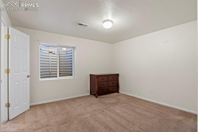 unfurnished bedroom featuring light carpet