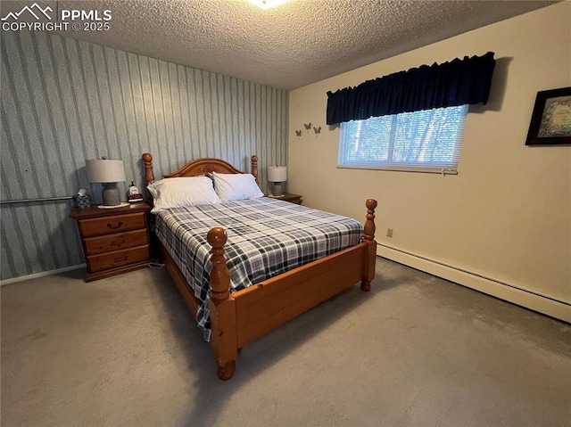 carpeted bedroom featuring a textured ceiling and baseboard heating