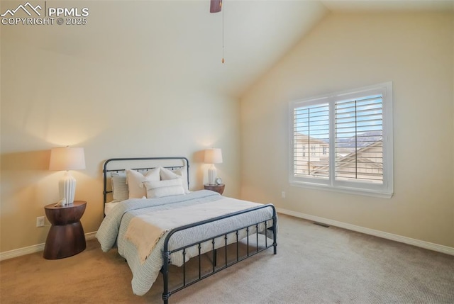 bedroom with ceiling fan, light colored carpet, and lofted ceiling