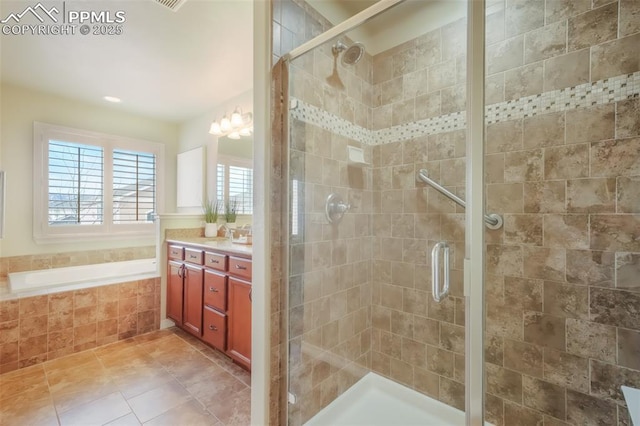 bathroom featuring vanity, tile patterned floors, and shower with separate bathtub