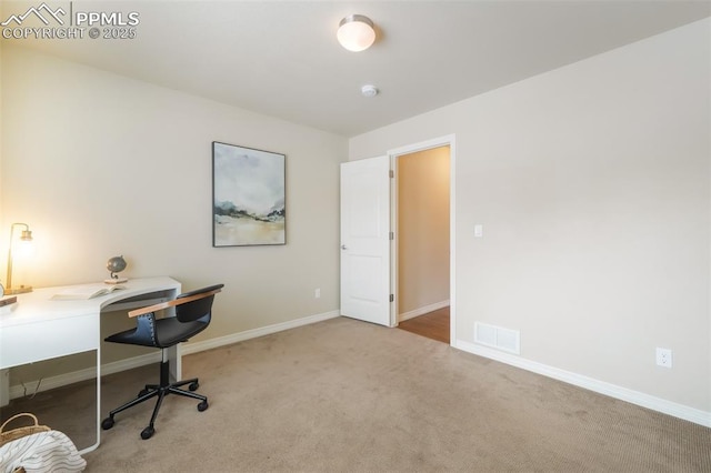 home office with light colored carpet