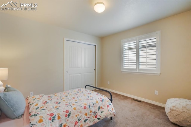 bedroom featuring a closet and carpet